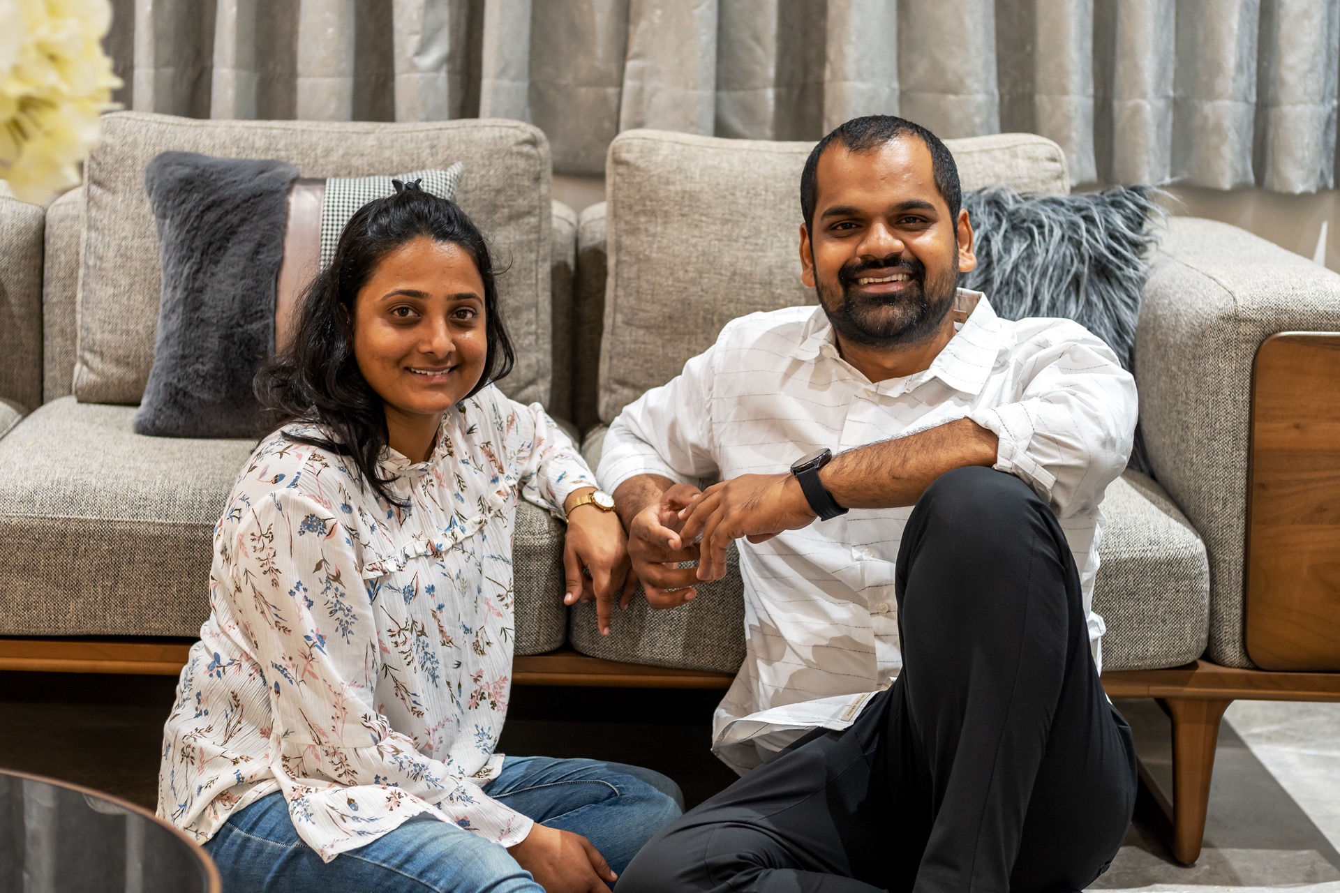 The Chaudhari Associates founders seated in a living room they designed