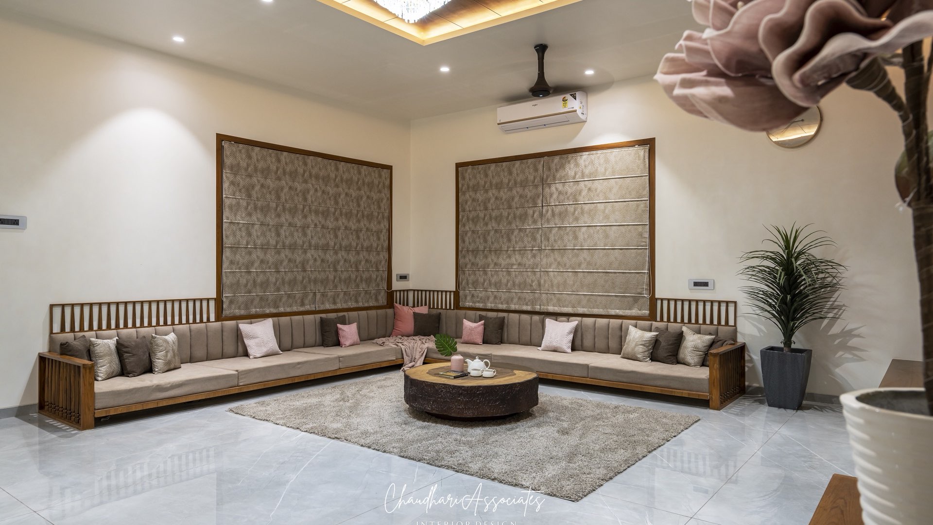 Spacious family lounge with an L-shaped timber-and-upholstery sofa, coffered timber ceiling and floor-to-ceiling blinds — Gajlakshmi, Shirur