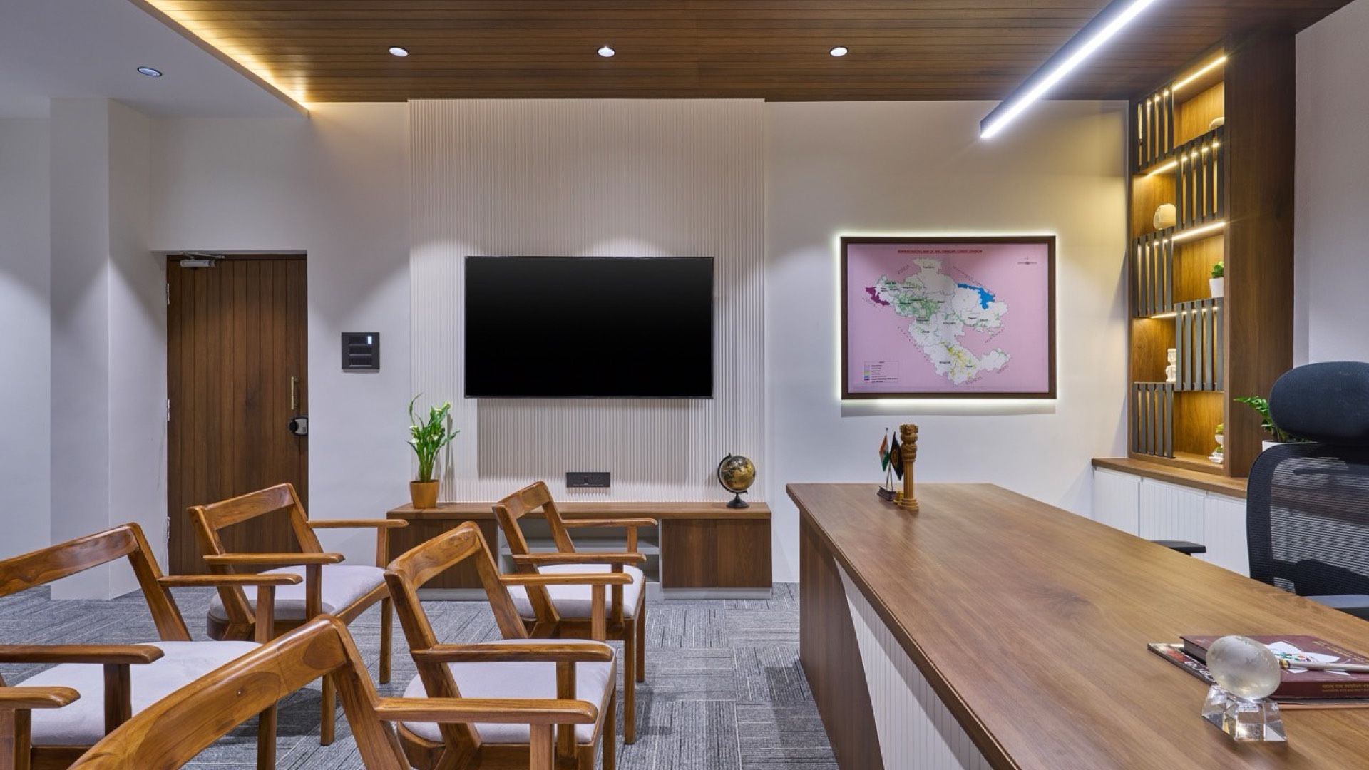 Officer’s cabin with a teak-finish ceiling, linear lighting and a long timber desk — DCF Office, Ahilyanagar